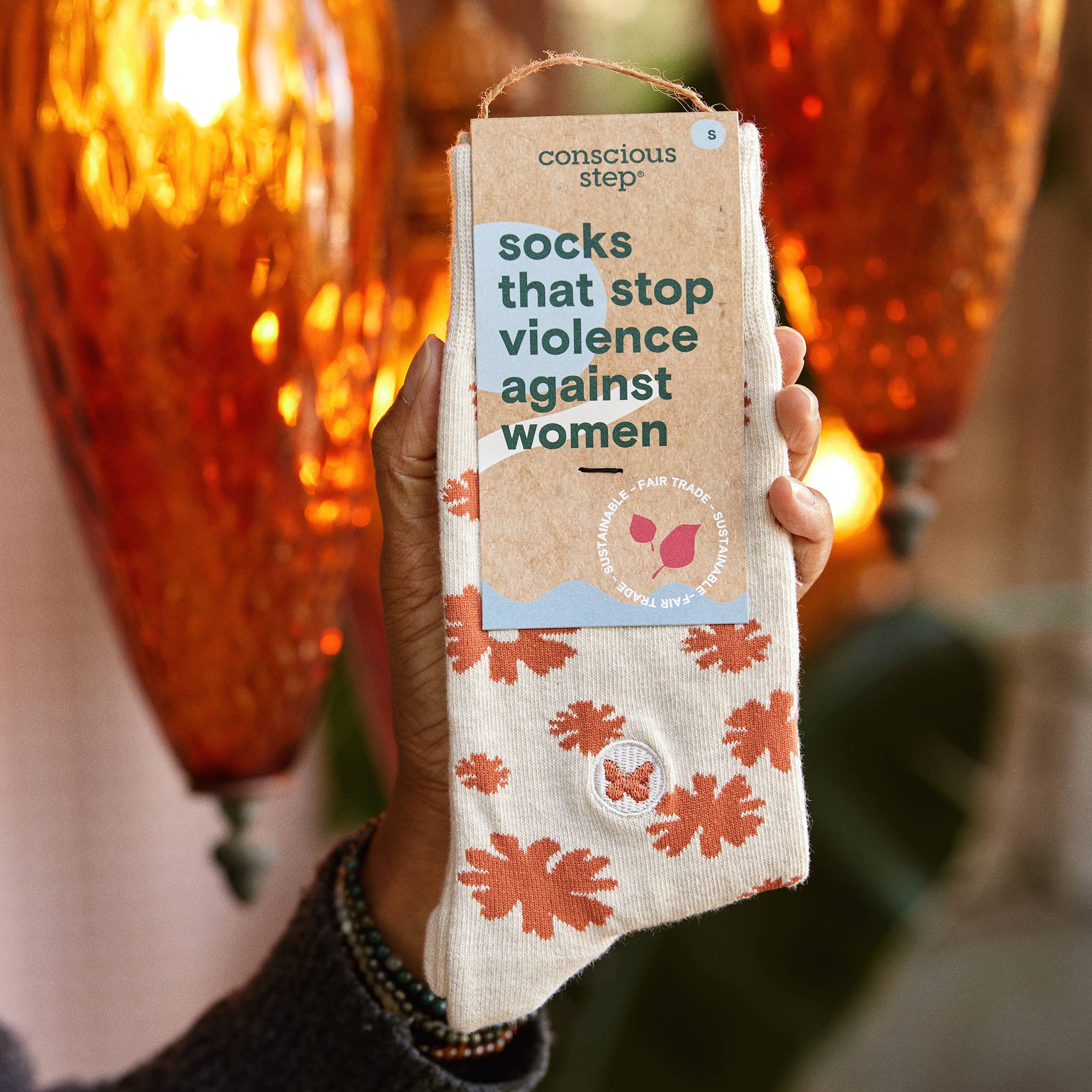 Socks that Stop Violence Against Women (Orange Flowers) by Conscious Step