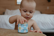 Cute baby with Organic herbal baby diaper balm by Good Flower Farm 