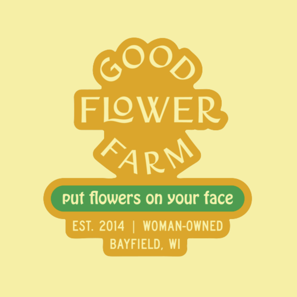 Good Flower Farm Put Flowers on Your Face sticker features yellow and green text, including Est. 2014 | Woman-Owned | Bayfield, WI, on a bright yellow background.