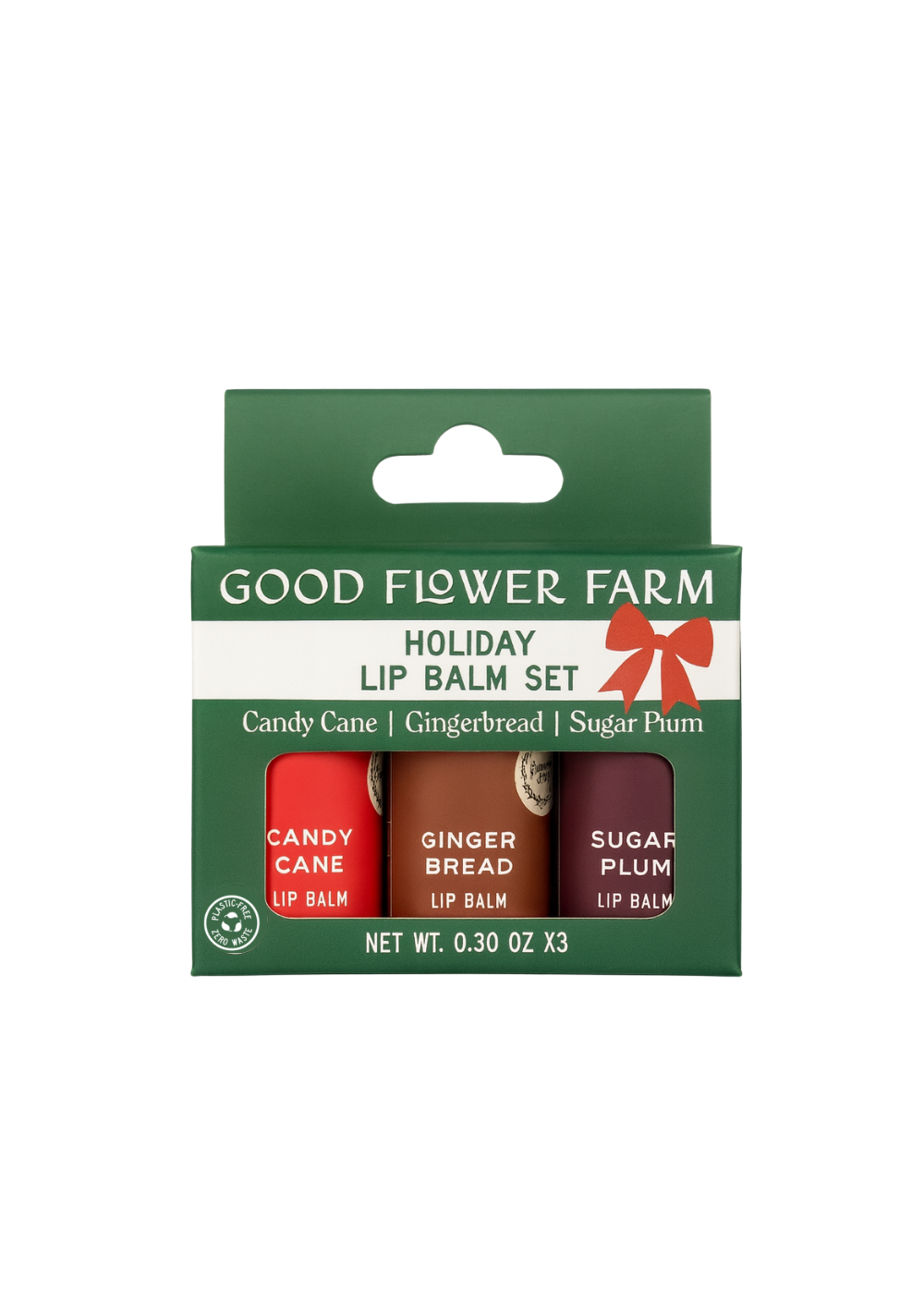 The SEASONAL LIMITED Holiday Lip Gift Set - NEW by Good Flower Farm is a green box with three eco-friendly lip balms—Candy Cane, Gingerbread, and Sugar Plum—in red, brown, and purple tubes.